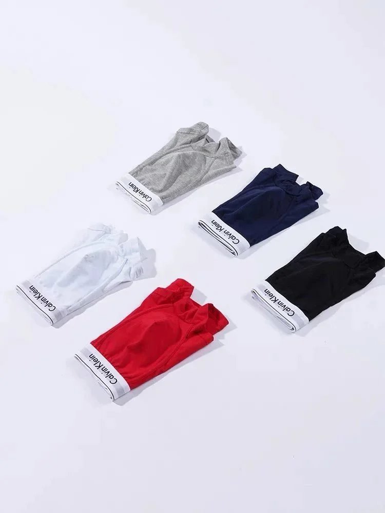 Calvin Klein Three-Pack Logo-Waistband Boxer Briefs in Solid Tones