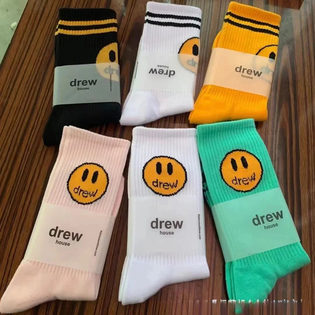 Skarpety Drew House ze smiley do połowy łydki, gładkie i w paski