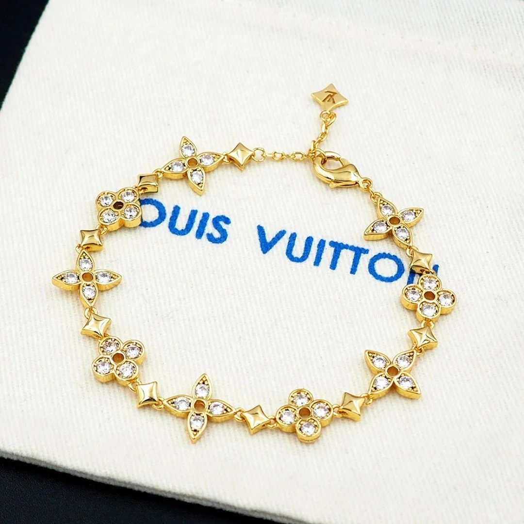 Armband met bloemschakels in goudtint of zilvertint en heldere stenen