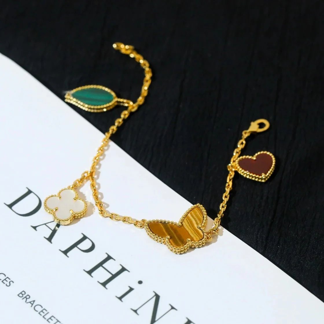 Louis Vuitton Gold-Tone Four-Charm Chain Bracelet with Mixed Shapes