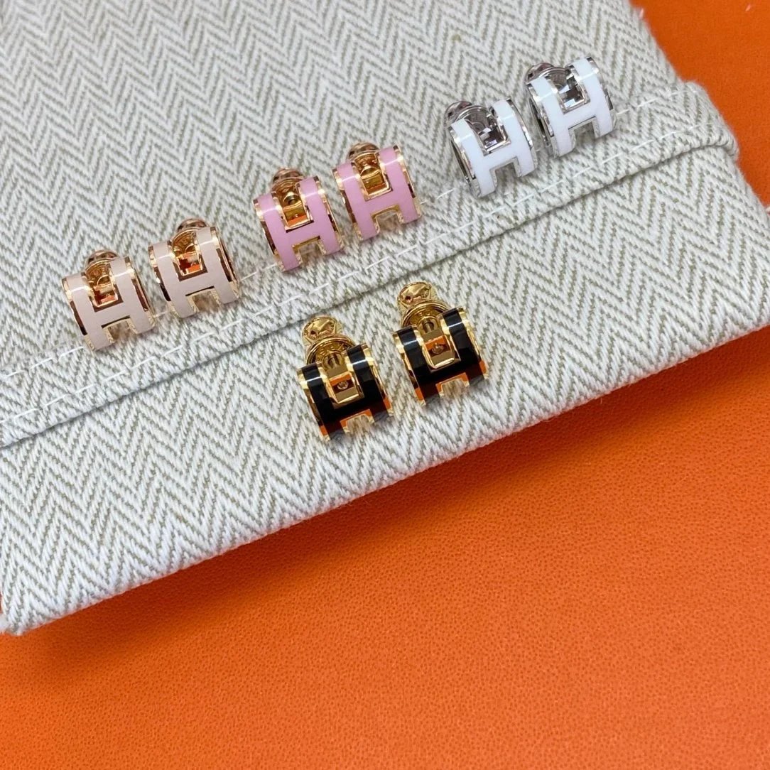 Orecchini a lobo Hermès a forma di H in bianco, nero, tono oro o rosa