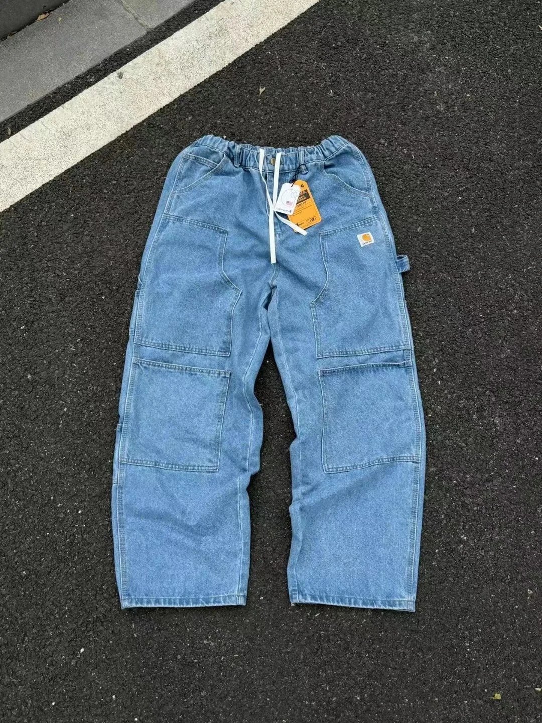 Pantaloni Carhartt in denim blu con dettagli a pannelli