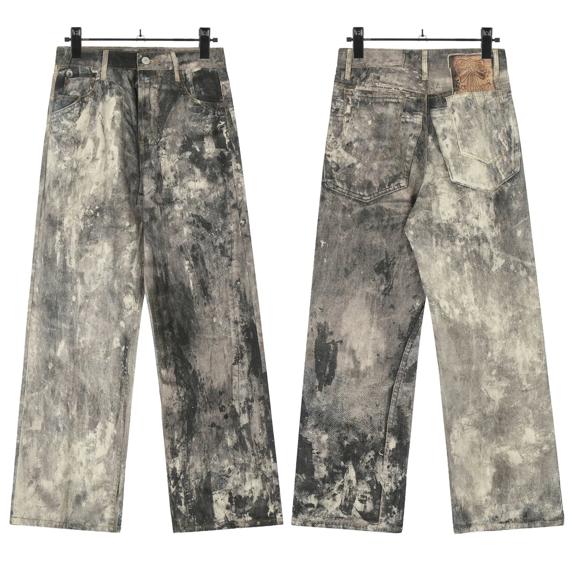 Jeans anchos grises con lavado de grafiti proyectado