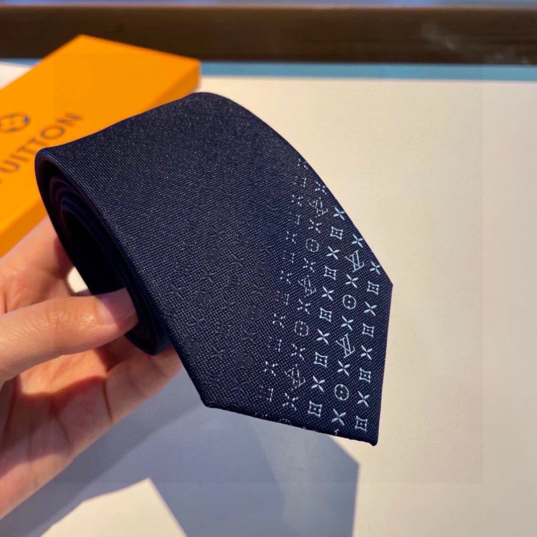 Krawat Louis Vuitton z jasnym pasem motywów i prostym końcem, trzy kolory