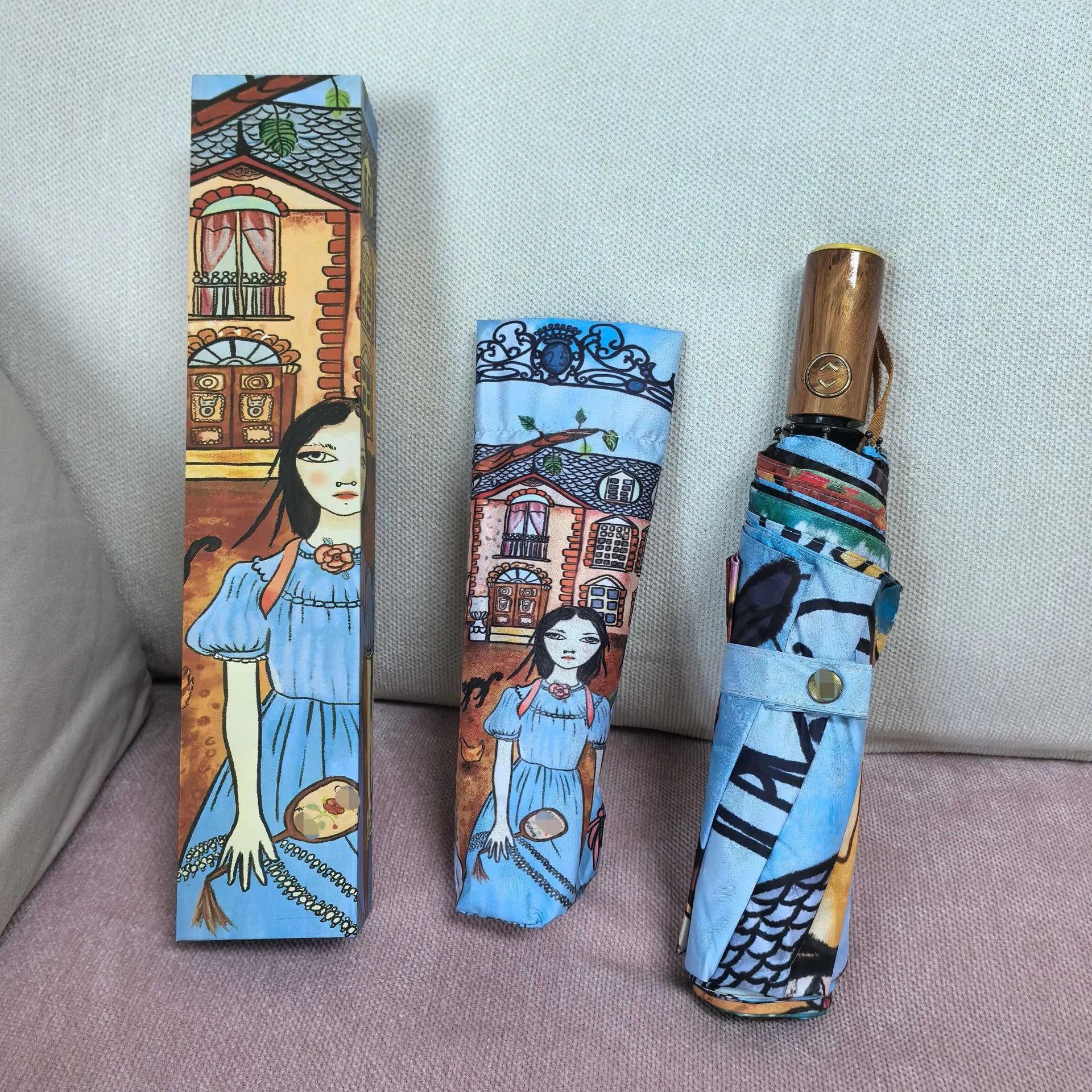 Folding umbrella with a colourful illustrated courtyard scene