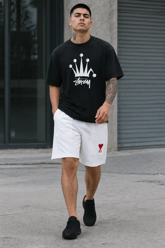 Look avec T-shirt Stüssy à manches, Short à cordon AMI Paris et Baskets basses Nike NOCTA · Diego