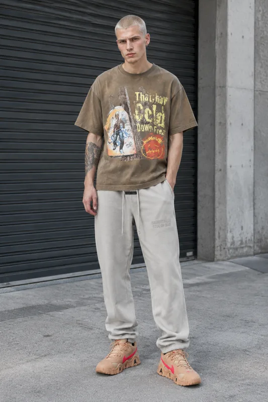 Travis Scott Graphic, Fear of God Essentials & Nike Barrage Low Lace-Up outfit · Luca